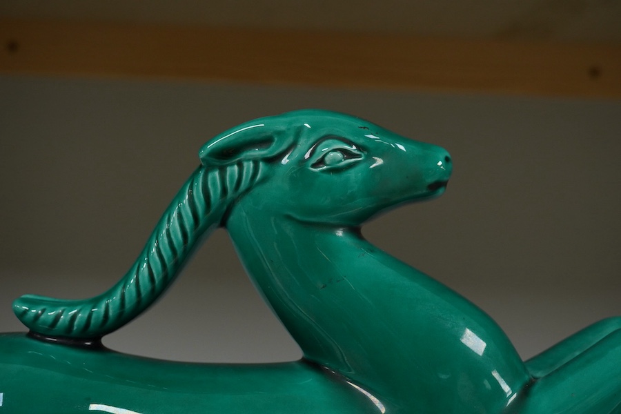 A French Art Deco ceramic antelope with green glaze, 46cm high. Condition - good